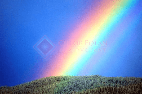 Text overlaid on circular rainbow image - Specialised accension readings and initiation guidance sessions available in person or by Skype.